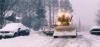 A snow plow maneuvering through the snowy Grand Marais streets - Video still courtesy of Cook County